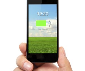 man hand holding the phone with charged battery