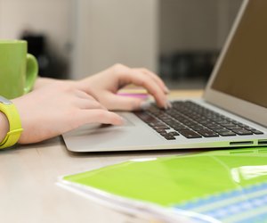 Young female working on Laptop close up View