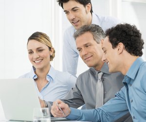 Businesspeople Working At Laptop