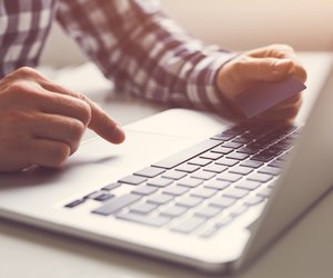 Man using touchpad on notebook