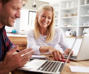 Man and woman working together at home
