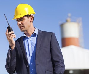 construction manager using walkie talkie