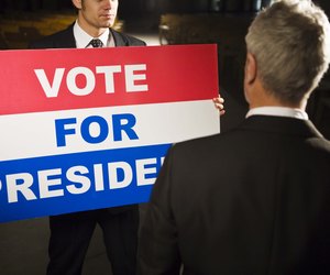 Politician with Vote For President sign