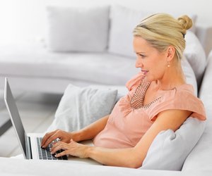 Mature woman using the laptop to browse the internet