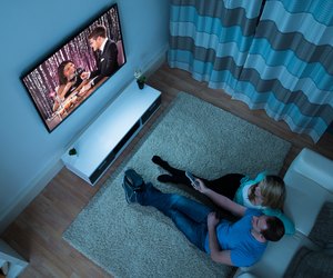 Couple Watching Movie In Living Room