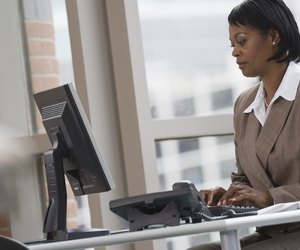 Businesswoman typing on computer