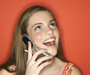 Cheerful woman talking on cell phone