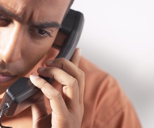 Serious man on telephone