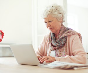 Elderly Woman Typing Something