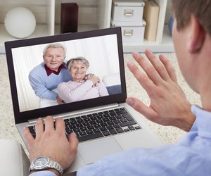 Man Video Conferencing On Laptop