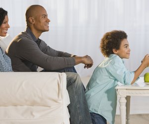 African family watching television