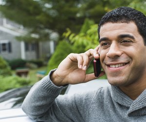 Man talking on a mobile phone and smiling