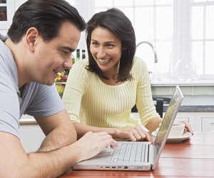 Couple using laptop