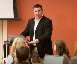 Teacher giving presentation to class