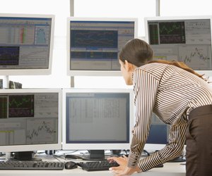 Stock Trader Examining Computer Monitors