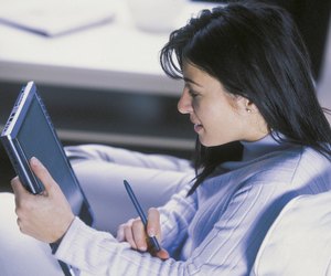Woman using tablet computer