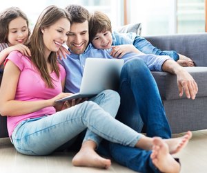 Family using laptop at home