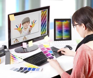 Graphic designer at work. Color samples.