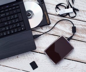 Laptop with pendrive, sd card, CD and portable hard drive.