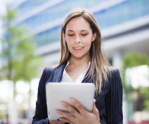 Business woman using a digital tablet