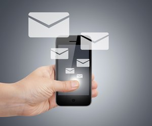 Hand with Smart Phone and Email Icons