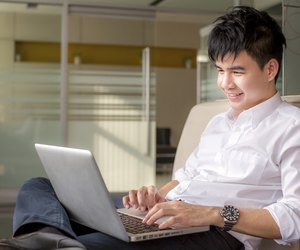 Young man on the sofa with a laptop