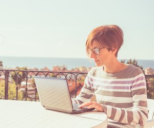Woman working at home with netbook outdoors