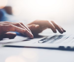 Photo businessman working with generic design notebook. Typing message, hands