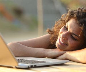 Woman watching media in a laptop