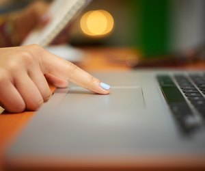Girl College Student Using Computer Trackpad At Night
