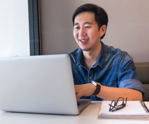Asian handsome man in working space for creative jobs