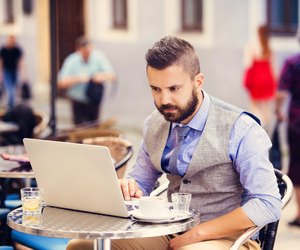 Hipster businessman in cafe
