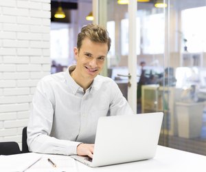 Man working on his laptop at the office in startup