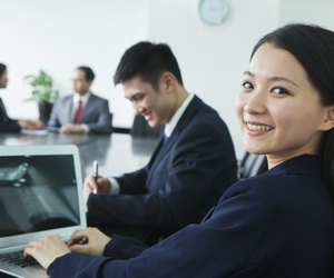 Businesswoman Looking Over Her Shoulder at the Camera