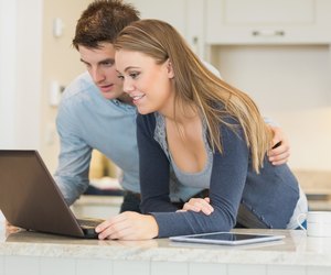 Man and woman chatting via webcam