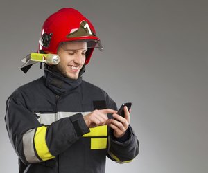 Firefighter using smart phone.
