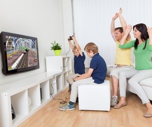 Young family playing video games