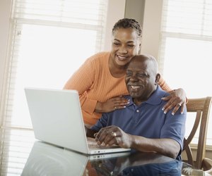 Couple using laptop