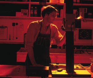 Photographer in darkroom