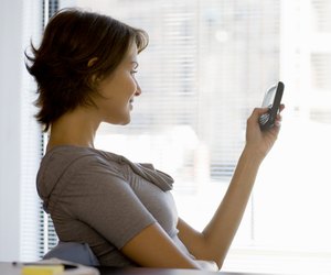 Businesswoman using personal organizer