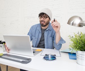 corporate portrait young hispanic hipster businessman working at office