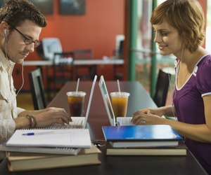 Couple working on laptop computers