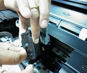 repairer of service hands repairing inkjet cartridge 2