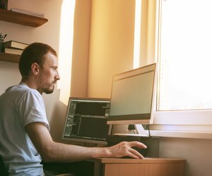 man working at home office computer