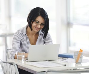 Portrait of a working businesswoman sitting at her desk