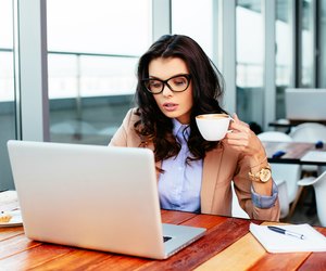 Enjoying time online with a cup of coffee