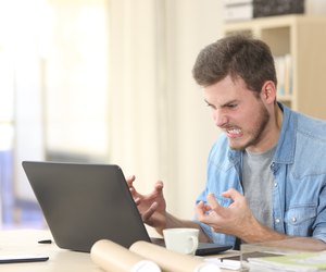 Entrepreneur angry and furious with laptop