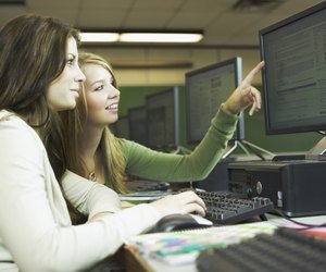 Teenage girls working in computer lab