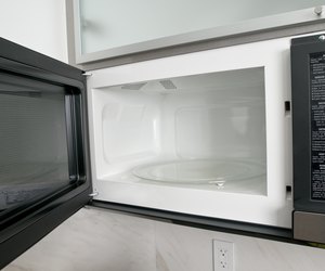 Open microwave oven in kitchen
