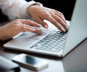 Hands on laptop keyboard